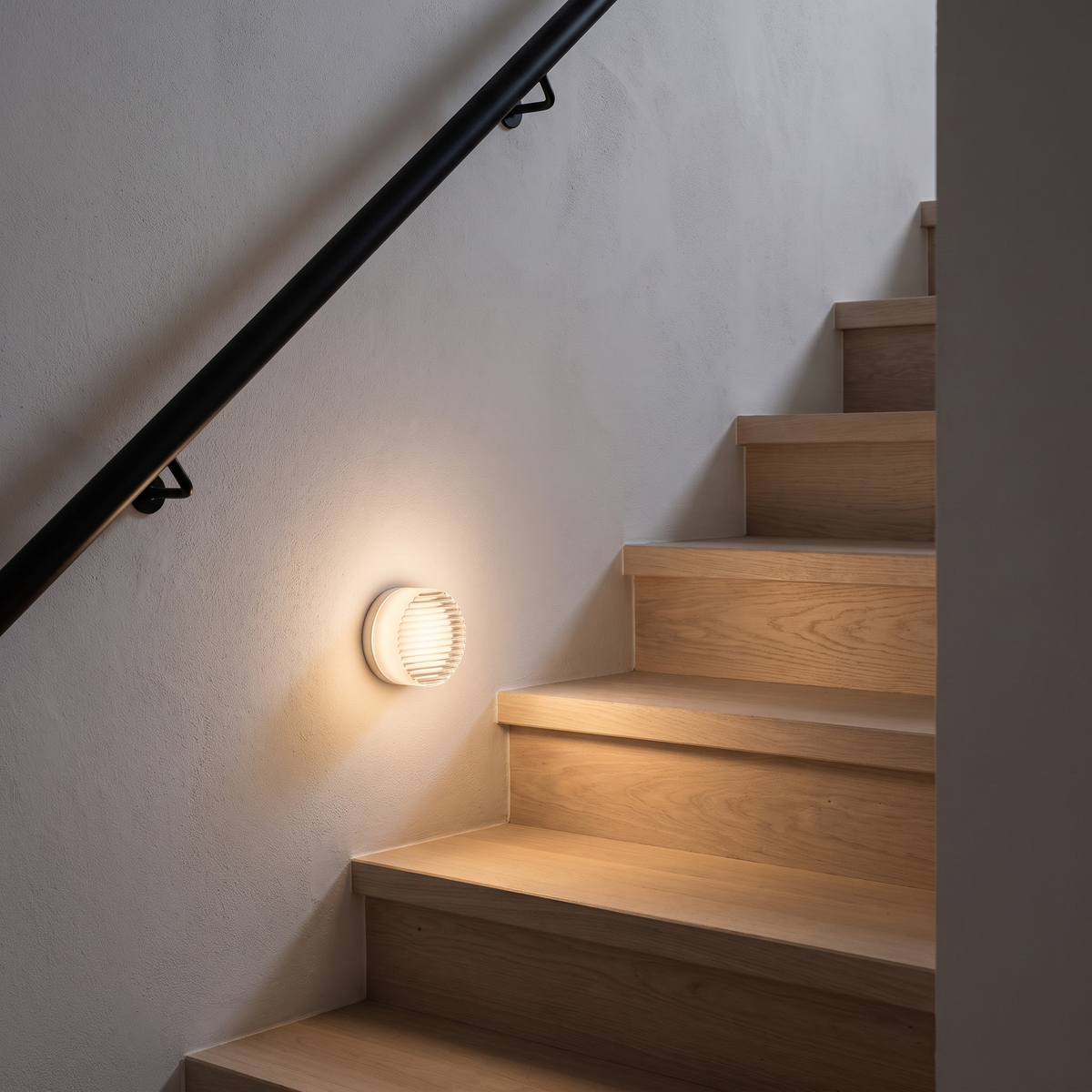 Comu smoky grey ribbed glass sensor light lighting oak stairs at night