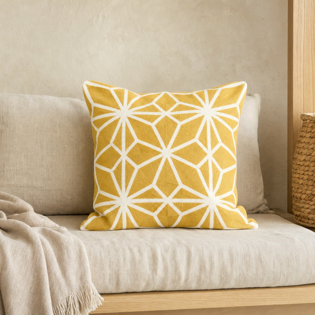 Diamond Tiles golden mustard geometric cushion cover on an oak-framed sofa with a linen throw