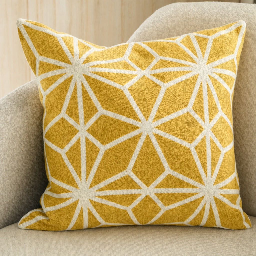 Close view of the Diamond Tiles mustard cushion cover showing its embroidered diamond tile pattern