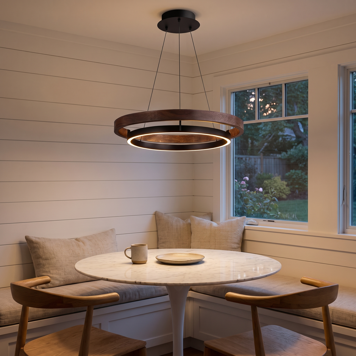 Fesha double-ring pendant over a marble breakfast table in a shiplap dining nook