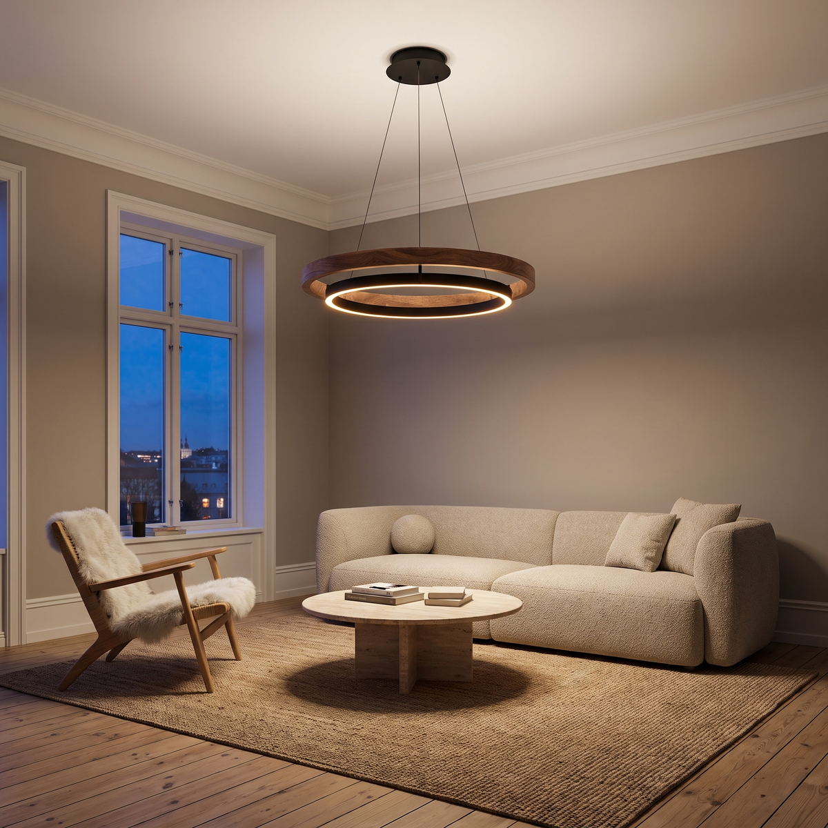 Fesha double-ring LED pendant glowing above a living room seating area in the evening