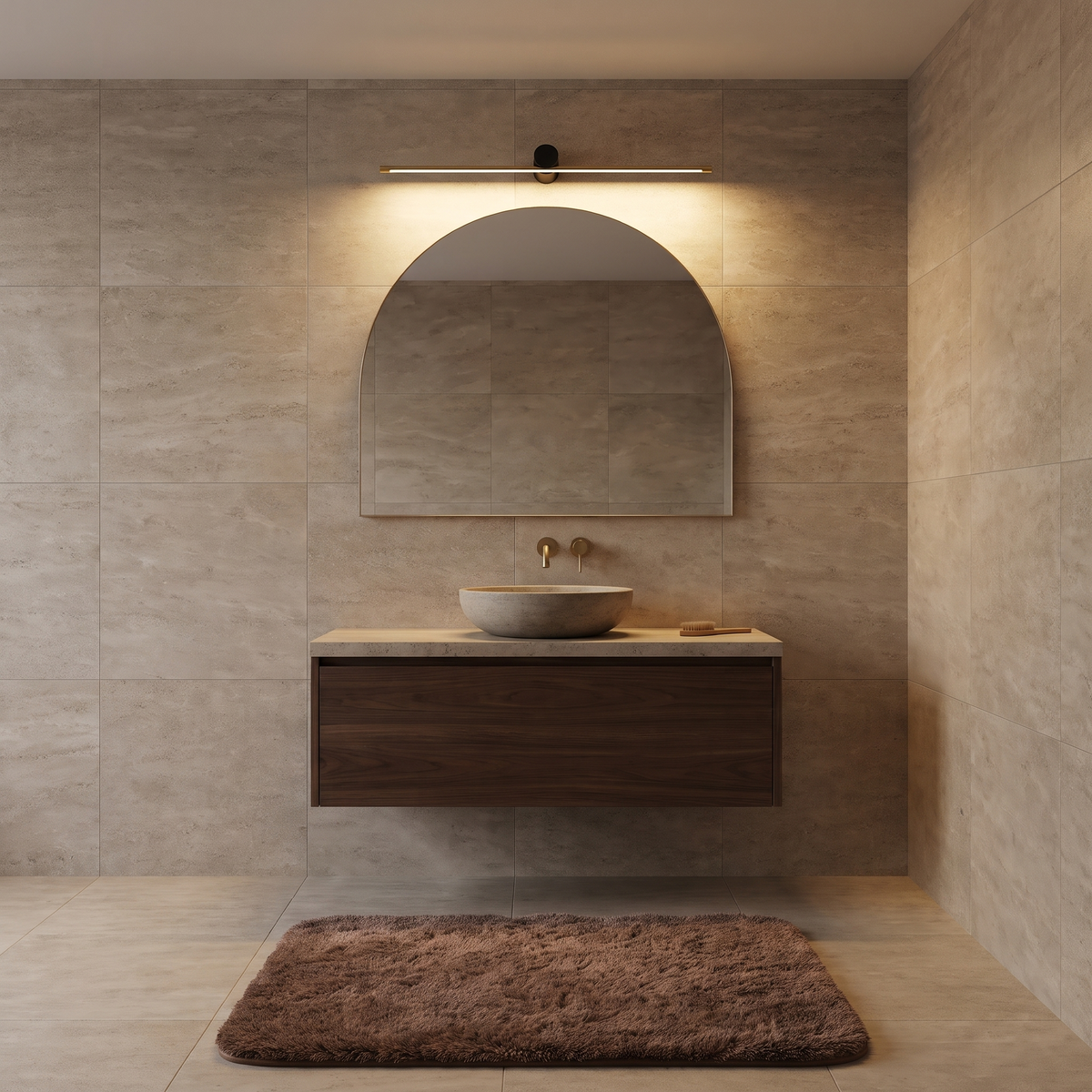 Gold and black Hartog vanity light bar above an arched mirror with a Cleo plush bath mat