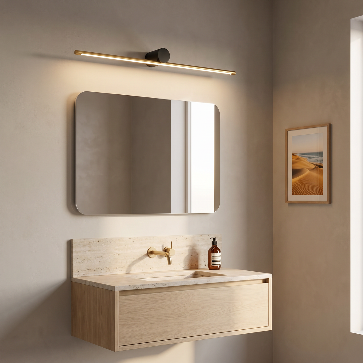 Hartog vanity light bar in gold and black over a rounded mirror in a travertine powder room
