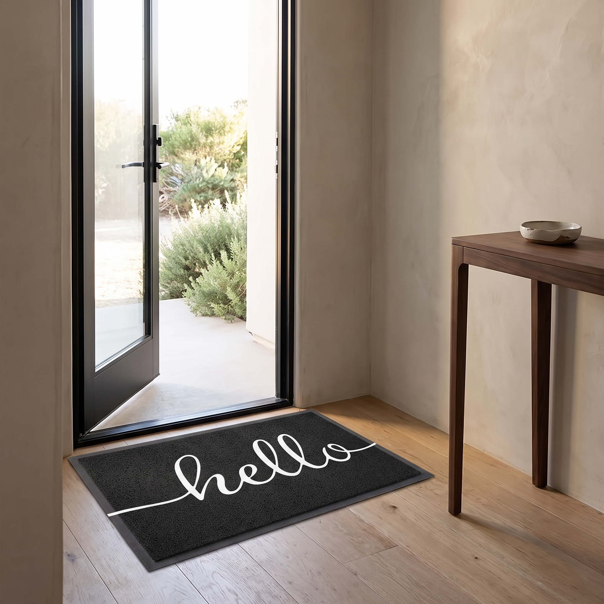 Hello welcome doormat in black on oak floorboards inside a coastal entry hall