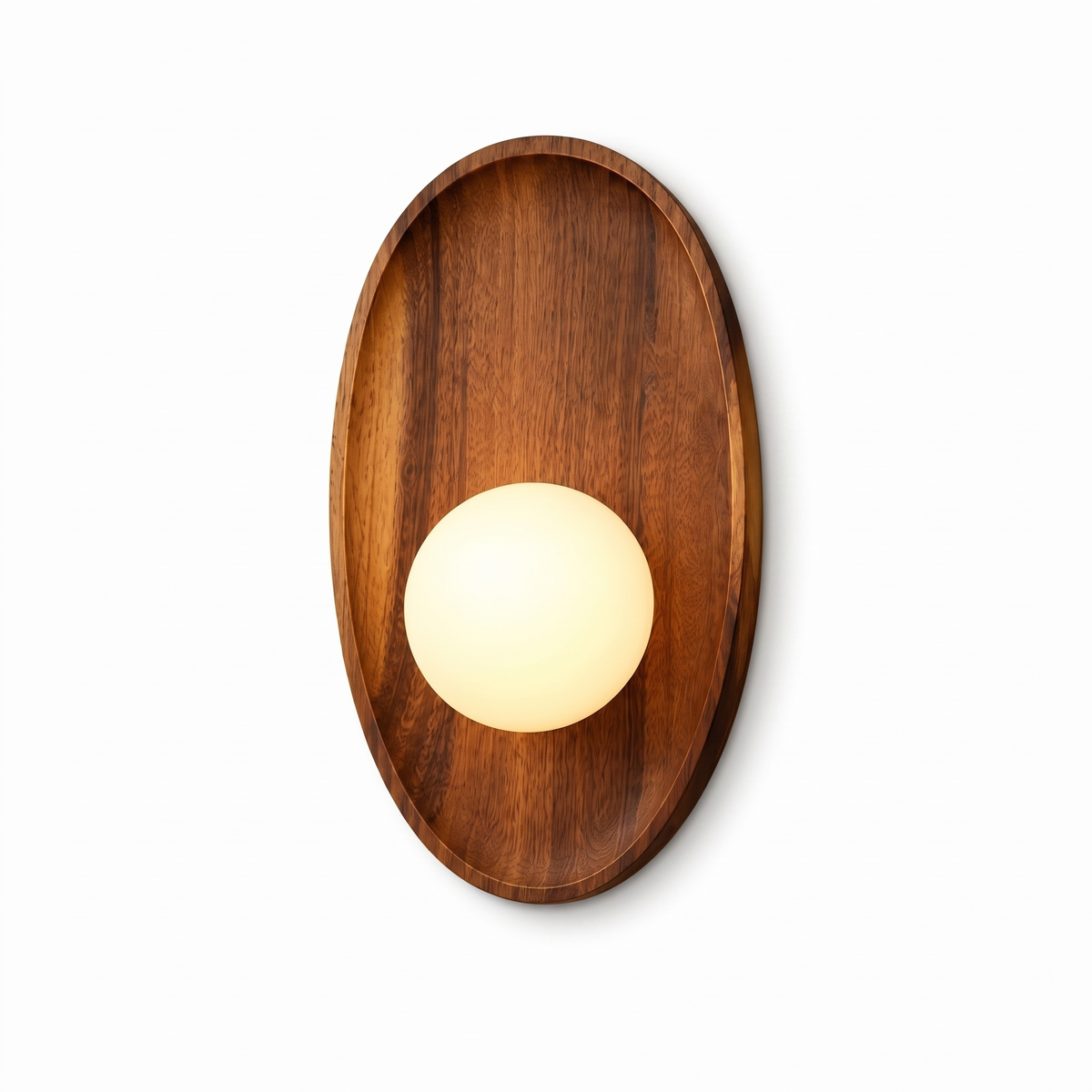 Henny walnut wall lamp with oval timber backplate and white glass globe on a white background