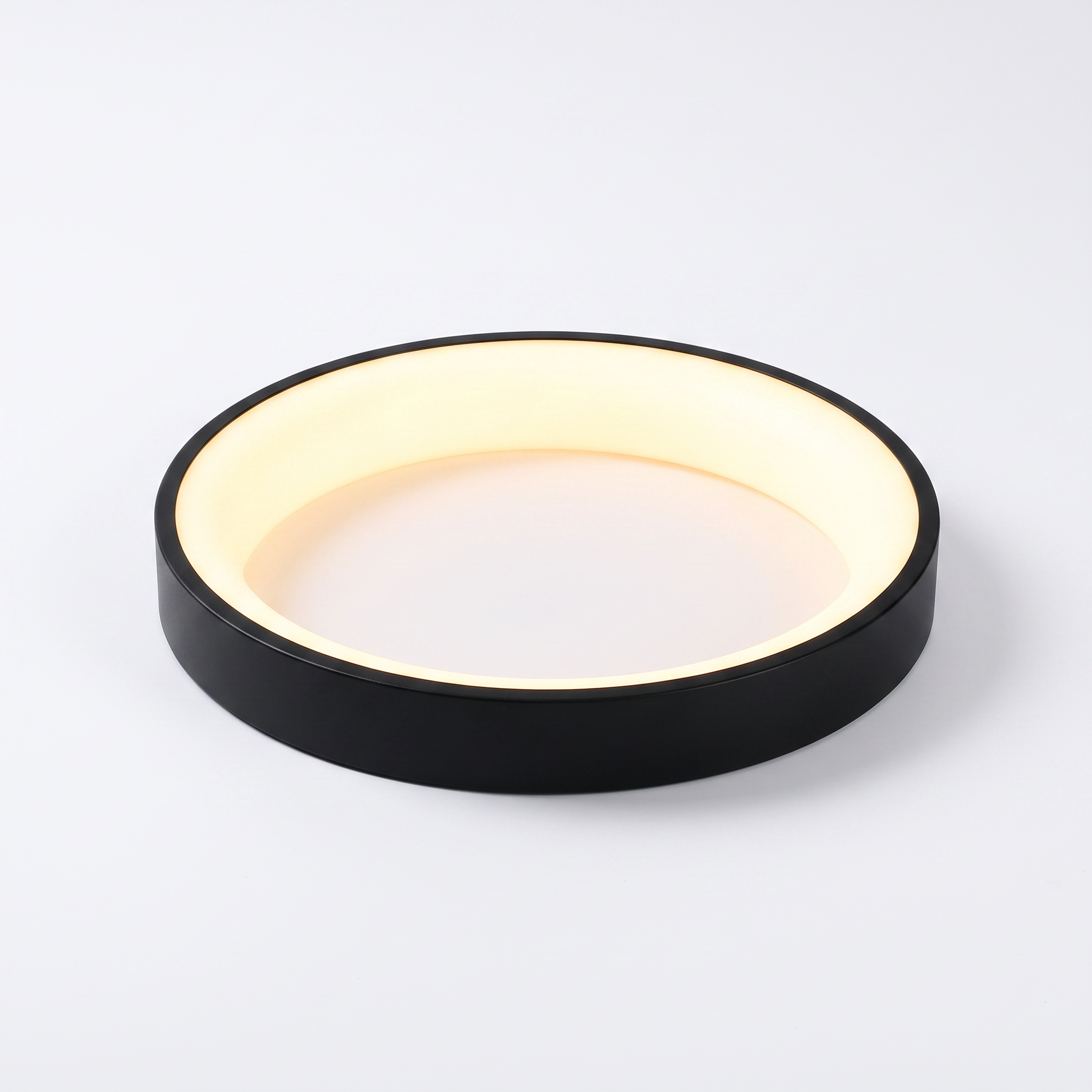 Jilliby LED oyster light in black on a white studio background