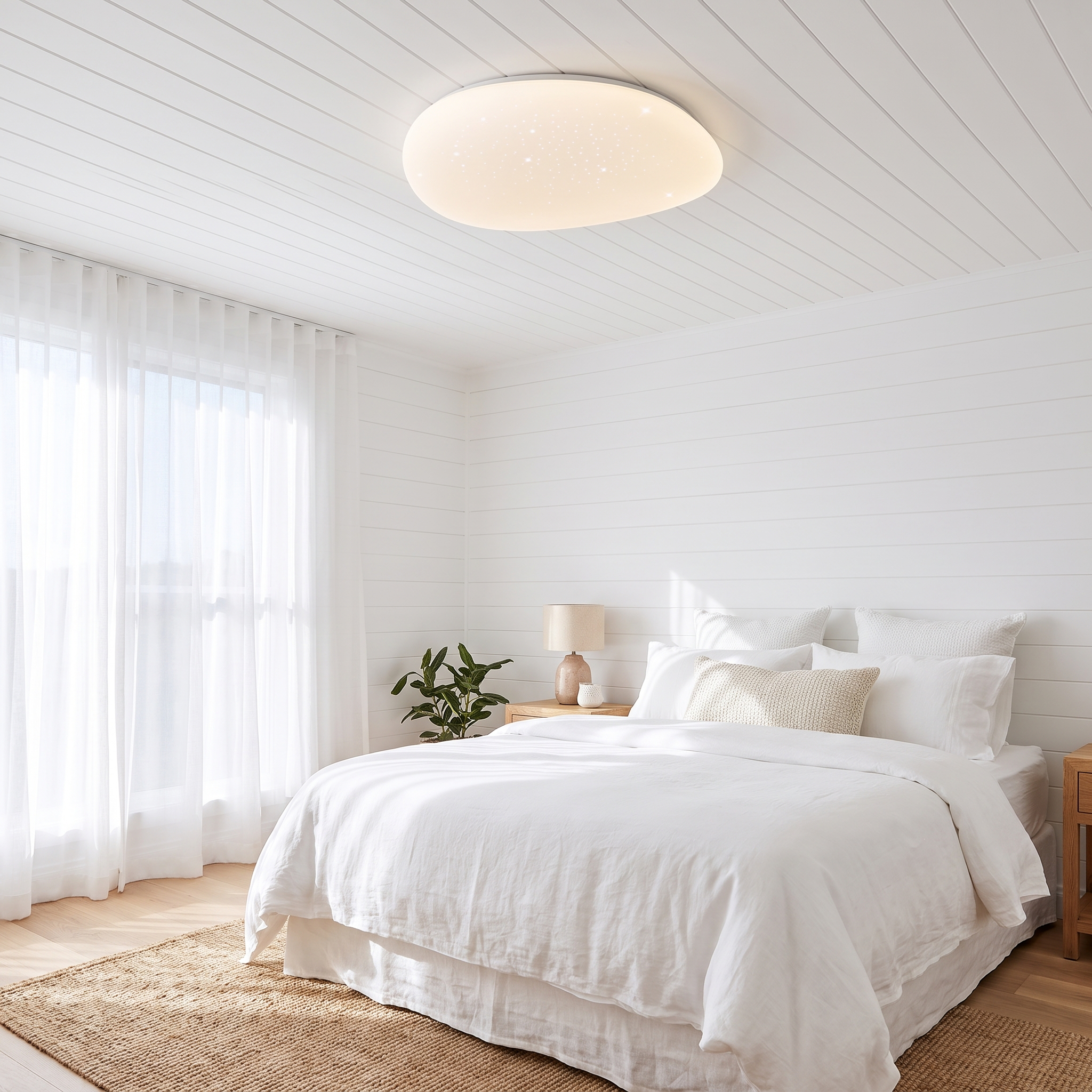 Cali LED ceiling light in a bright coastal beach house bedroom
