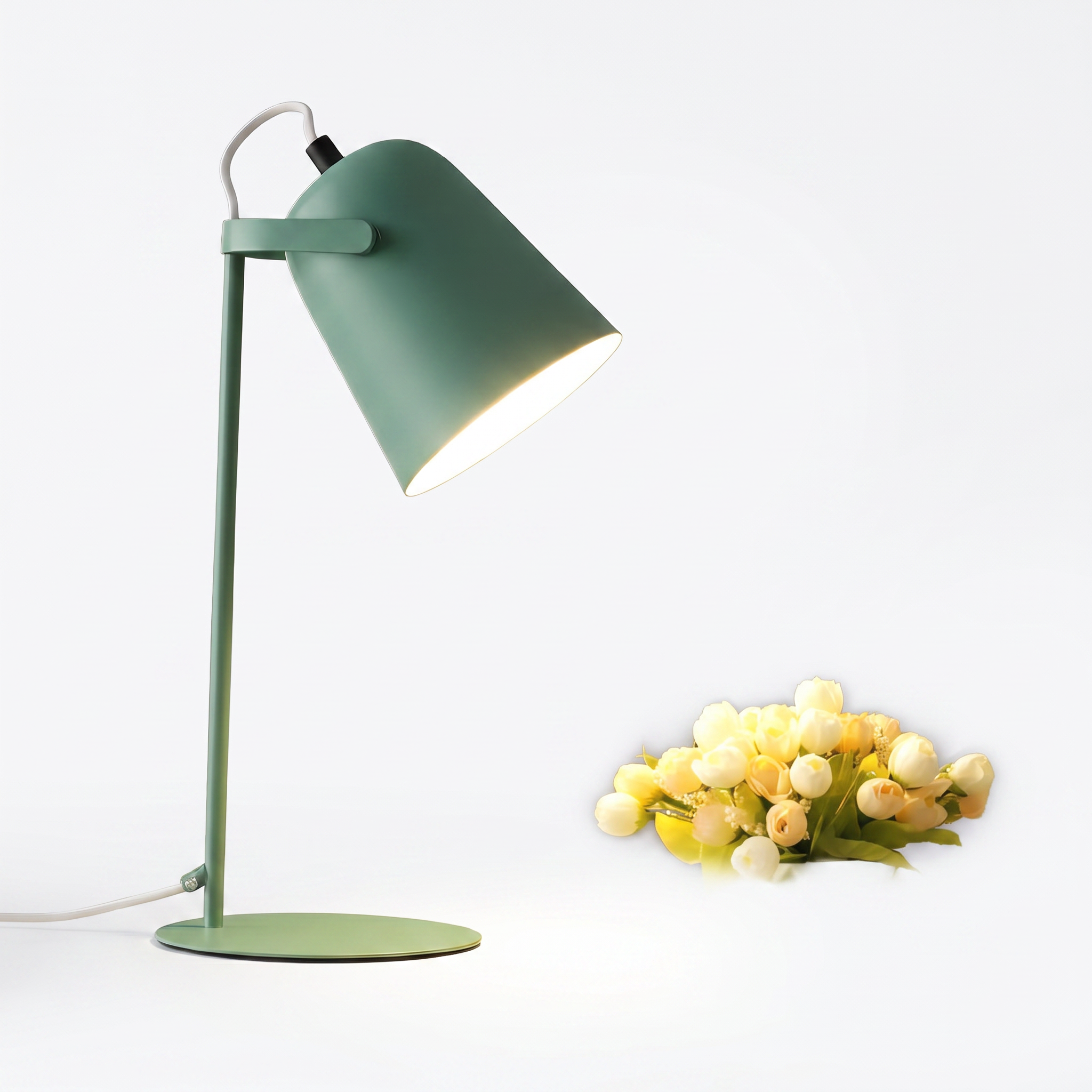 Hossegor matte macaron adjustable table lamp in green on a white background