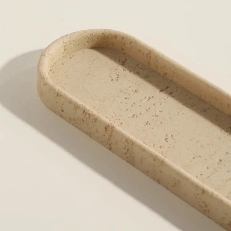 Iven Sandstone soap dispenser styled alongside matching pieces