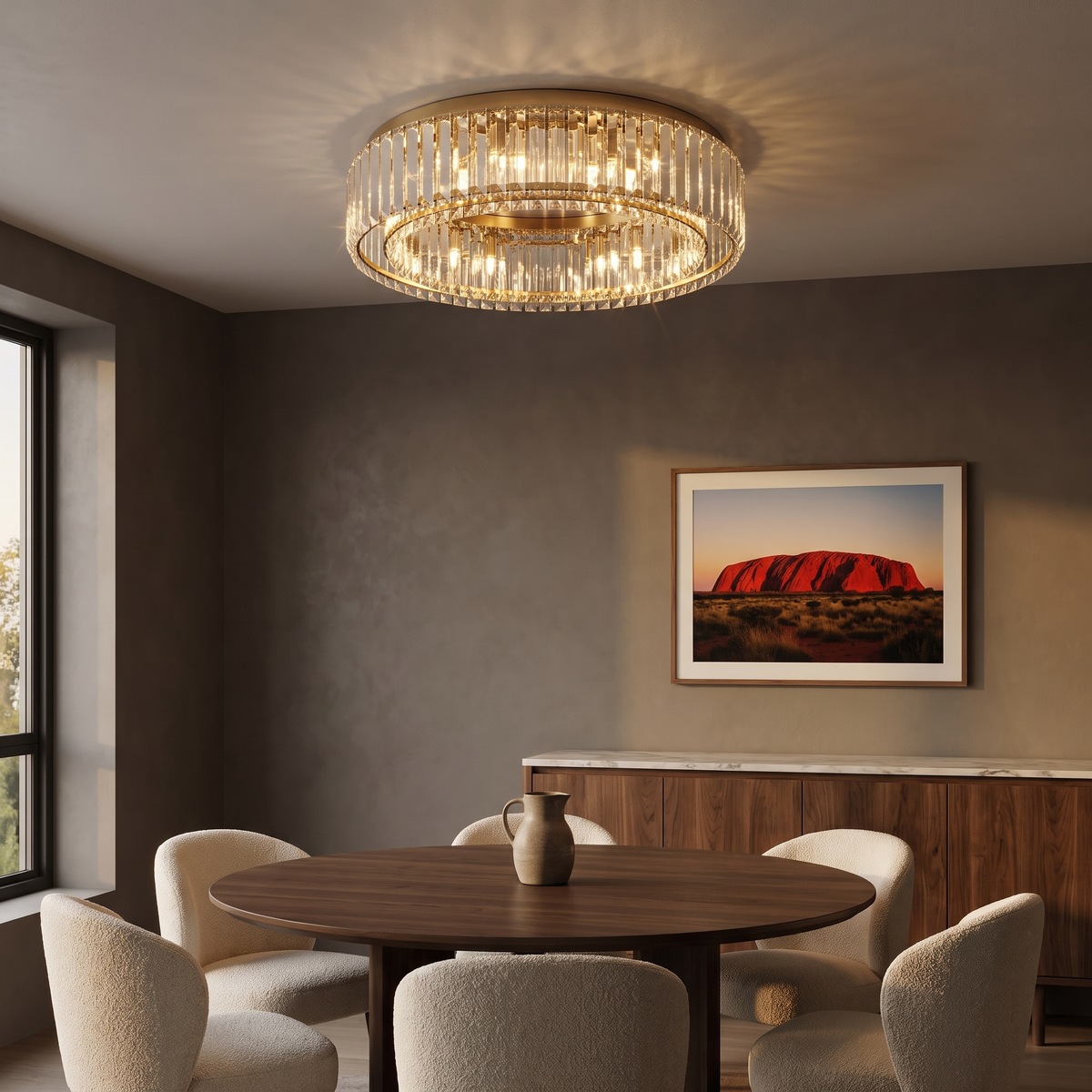 Gold Jessi crystal ceiling light above a round walnut dining table in a moody dining room