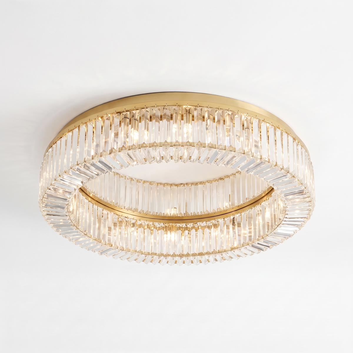Jessi crystal flush mount ceiling light in gold on a white background