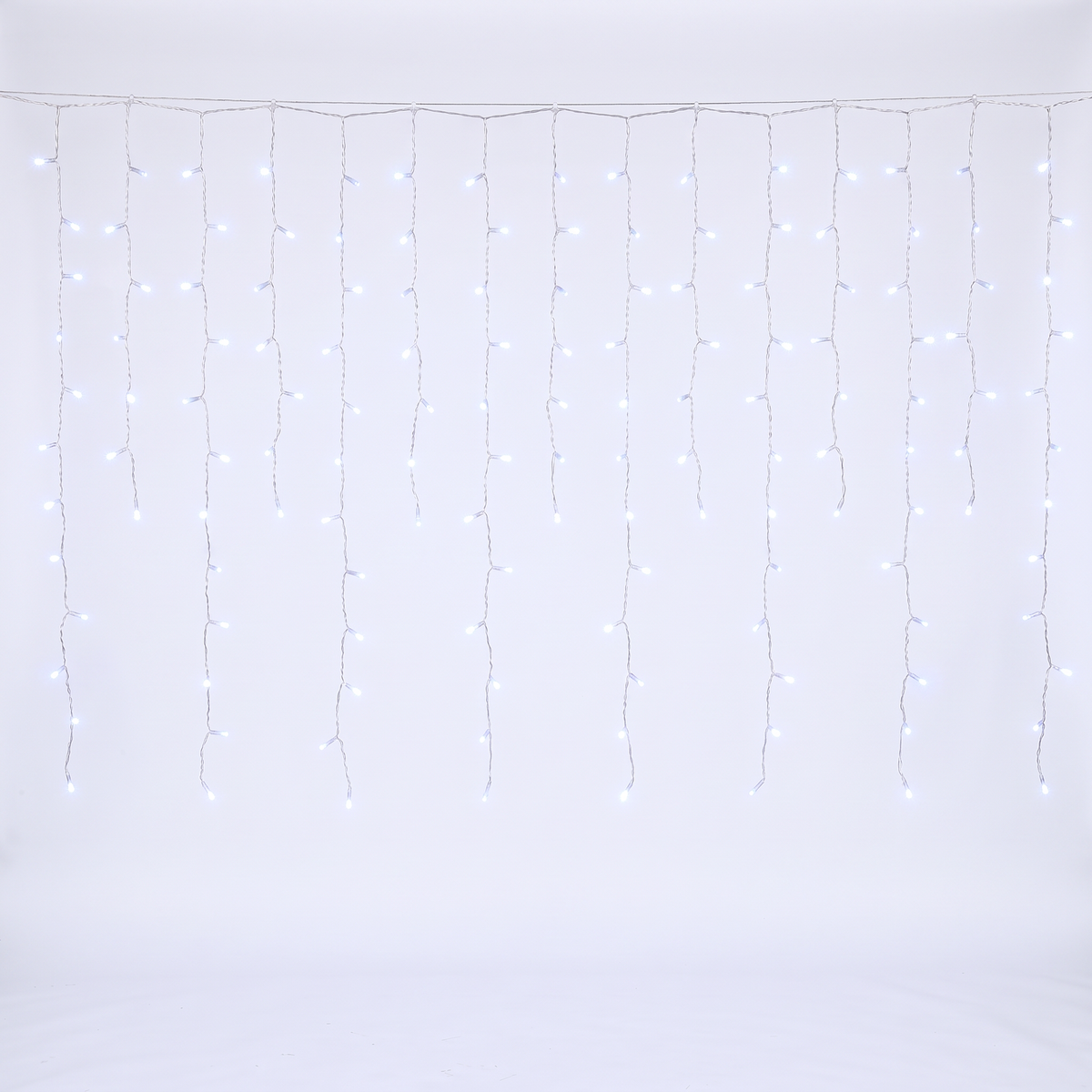 Jingle LED icicle lights in cold white on a white background