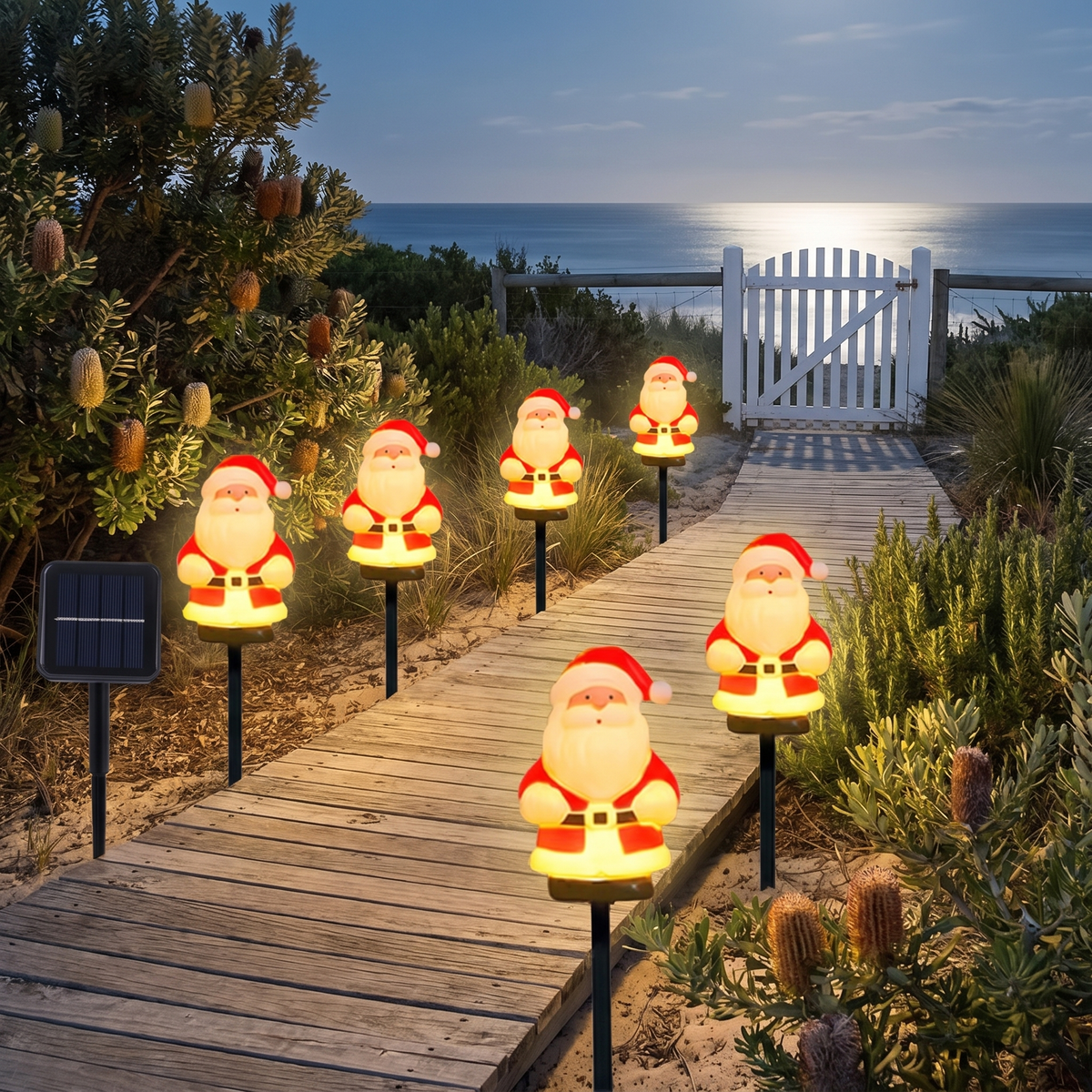 Jolly solar Santa garden lights along a coastal boardwalk at night