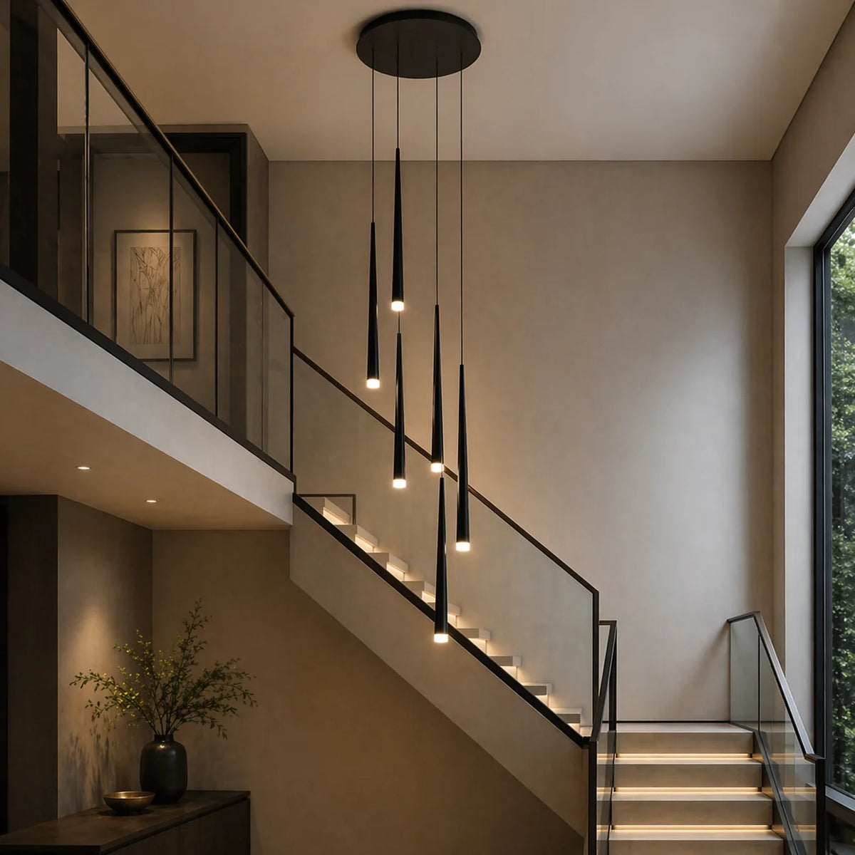 Black Jundaru cluster pendant light with six lights hanging in a modern stairwell