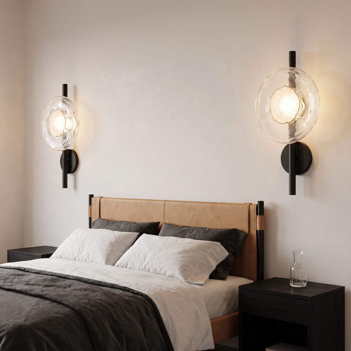 Pair of Kevi clear ripple glass wall lights on black rods either side of a bed