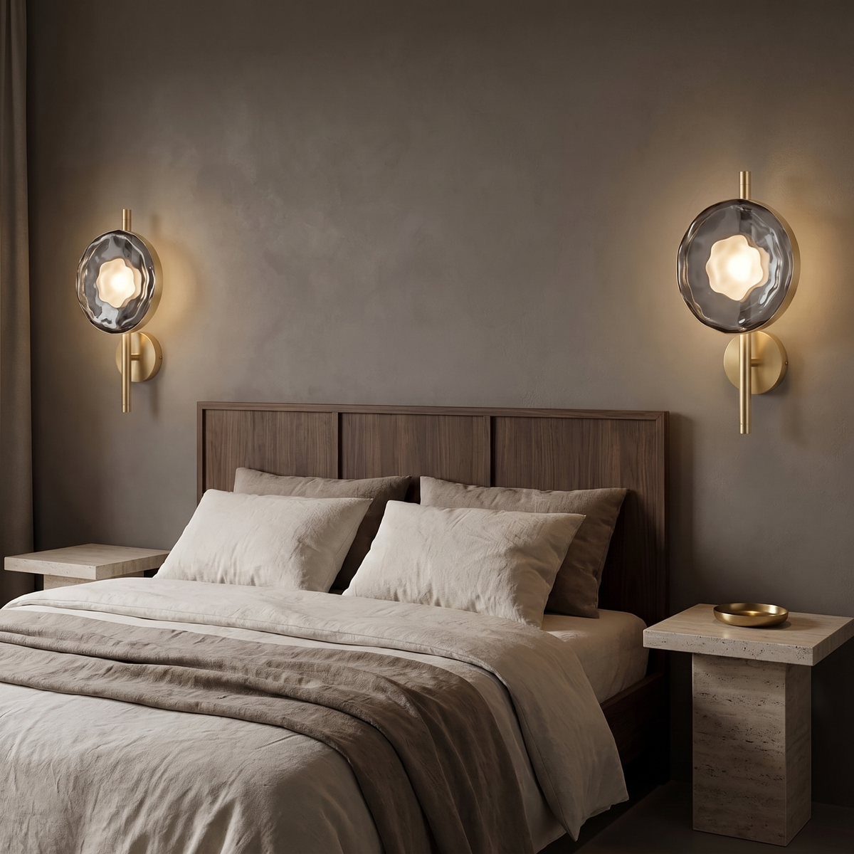 Pair of Kevi smoke grey glass wall lights on gold rods in a moody bedroom