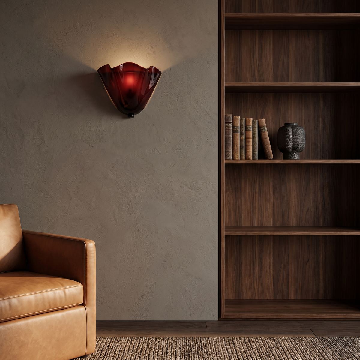 Kira artistic wall sconce in burgundy glass lit beside dark walnut shelving in a living room