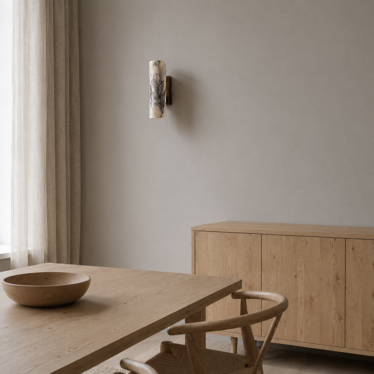 Kyst wall light shown in a living room setting