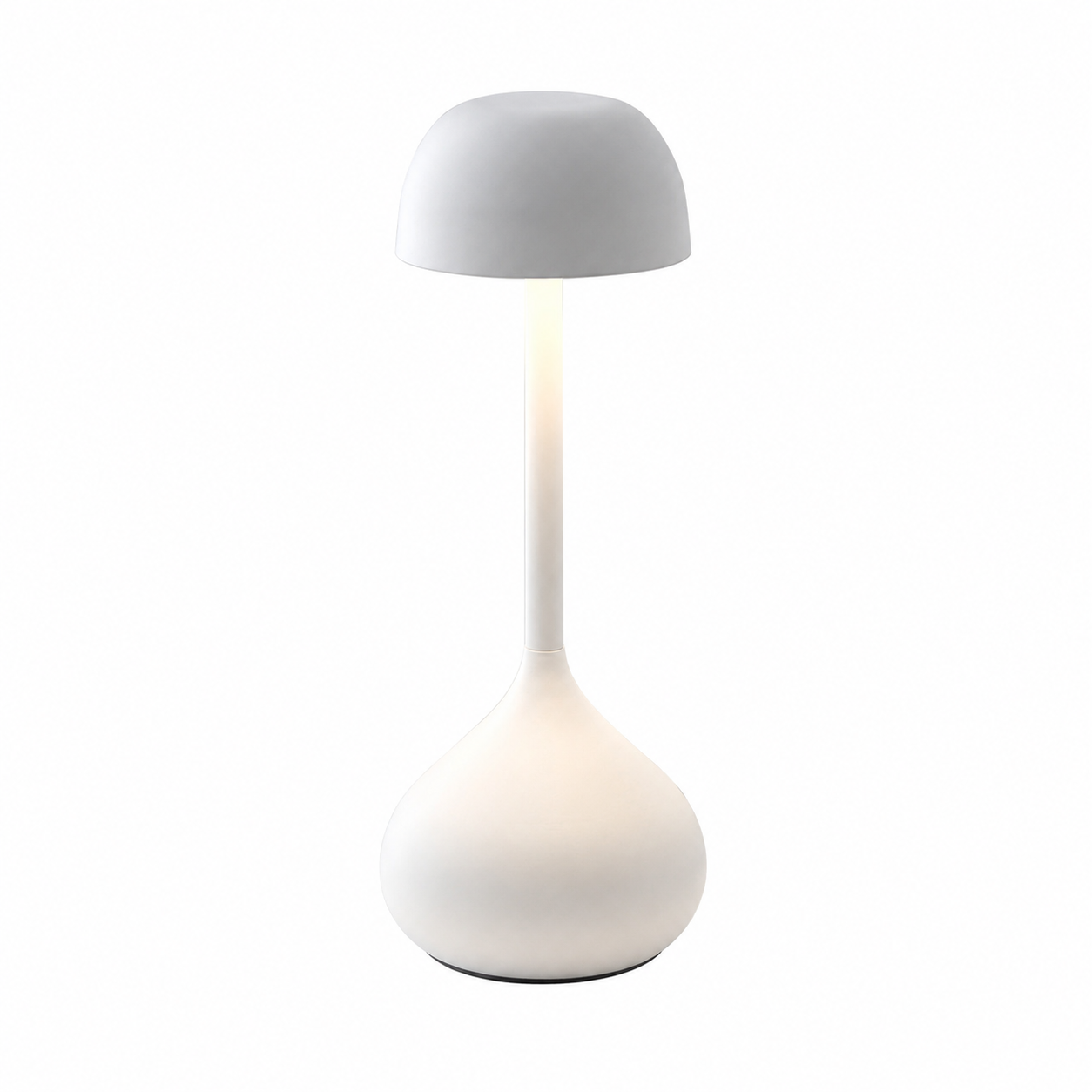 Lana portable table lamp glowing with warm white light on a nightstand