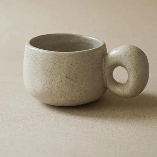 Lior Ceramic Coffee Mug in Brown styled on a kitchen counter
