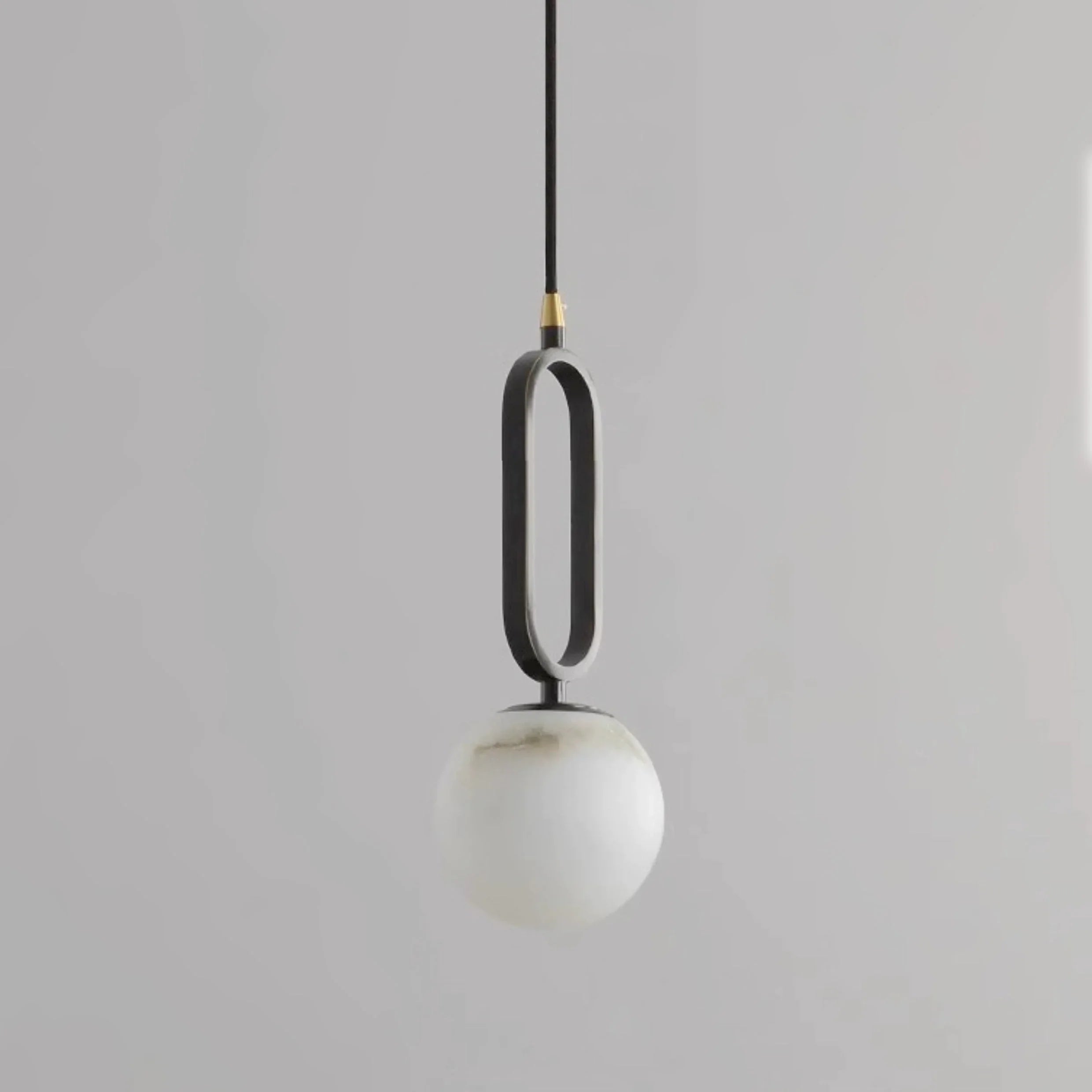 Maki Genuine Alabaster Pendant Light in a bedroom setting
