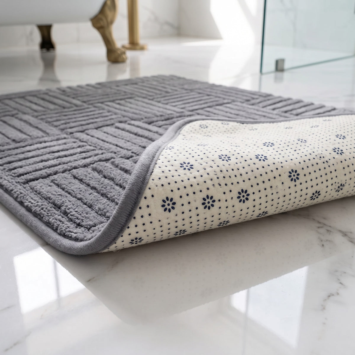 Marden bath mat in dark grey turned back to show its dotted non-slip rubber backing