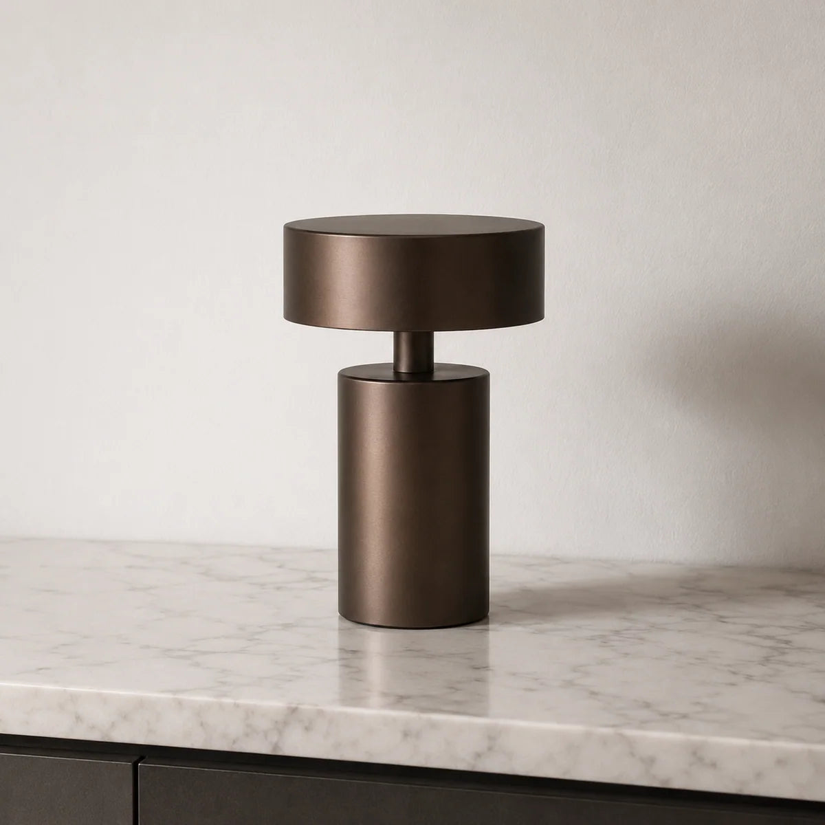 Mona portable table lamp glowing with warm ambient light