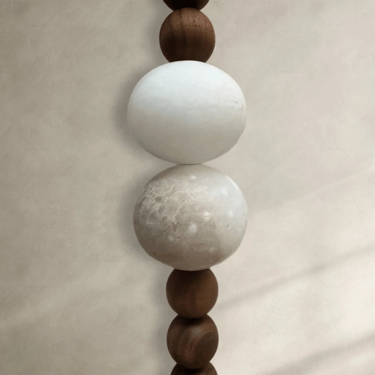 Naomi Art Deco wall sconce close-up of the timber and marble bead string