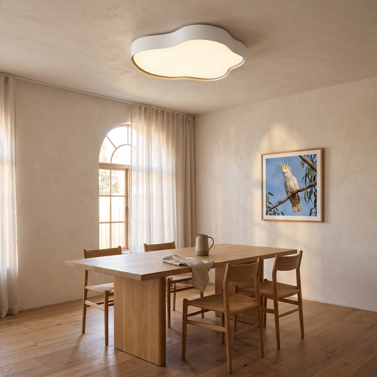 Ness LED cloud ceiling light over a Japandi dining room with an oak table and arched window