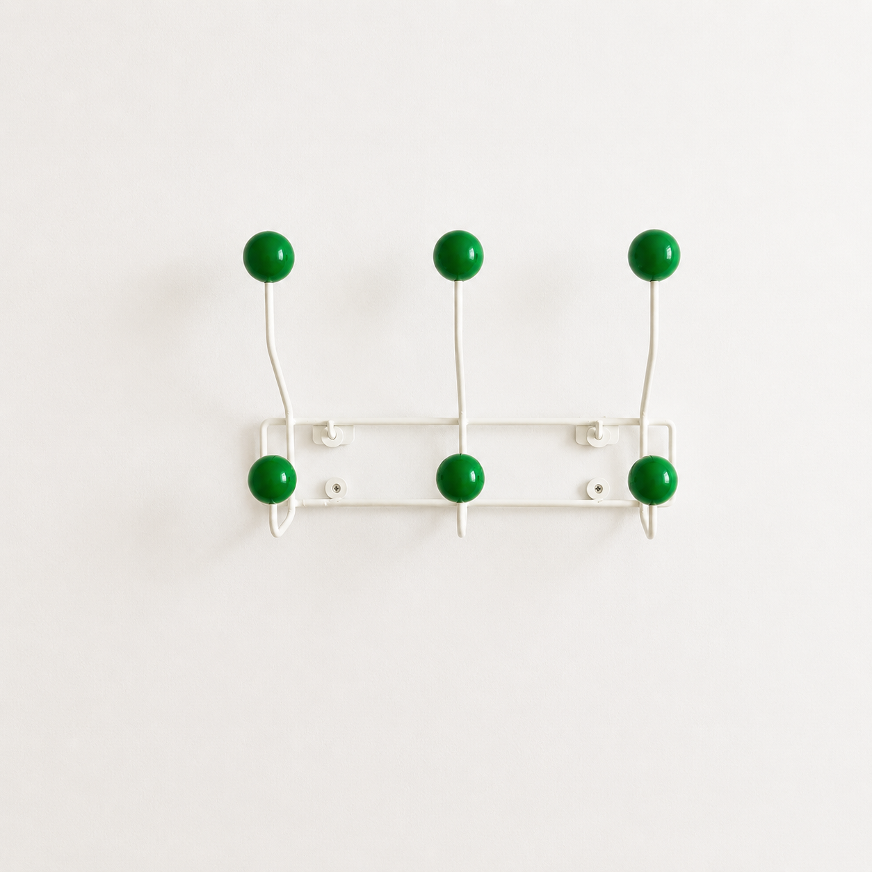 Close-up of the wood ball hook on the Newi Iron Wall Coat Rack