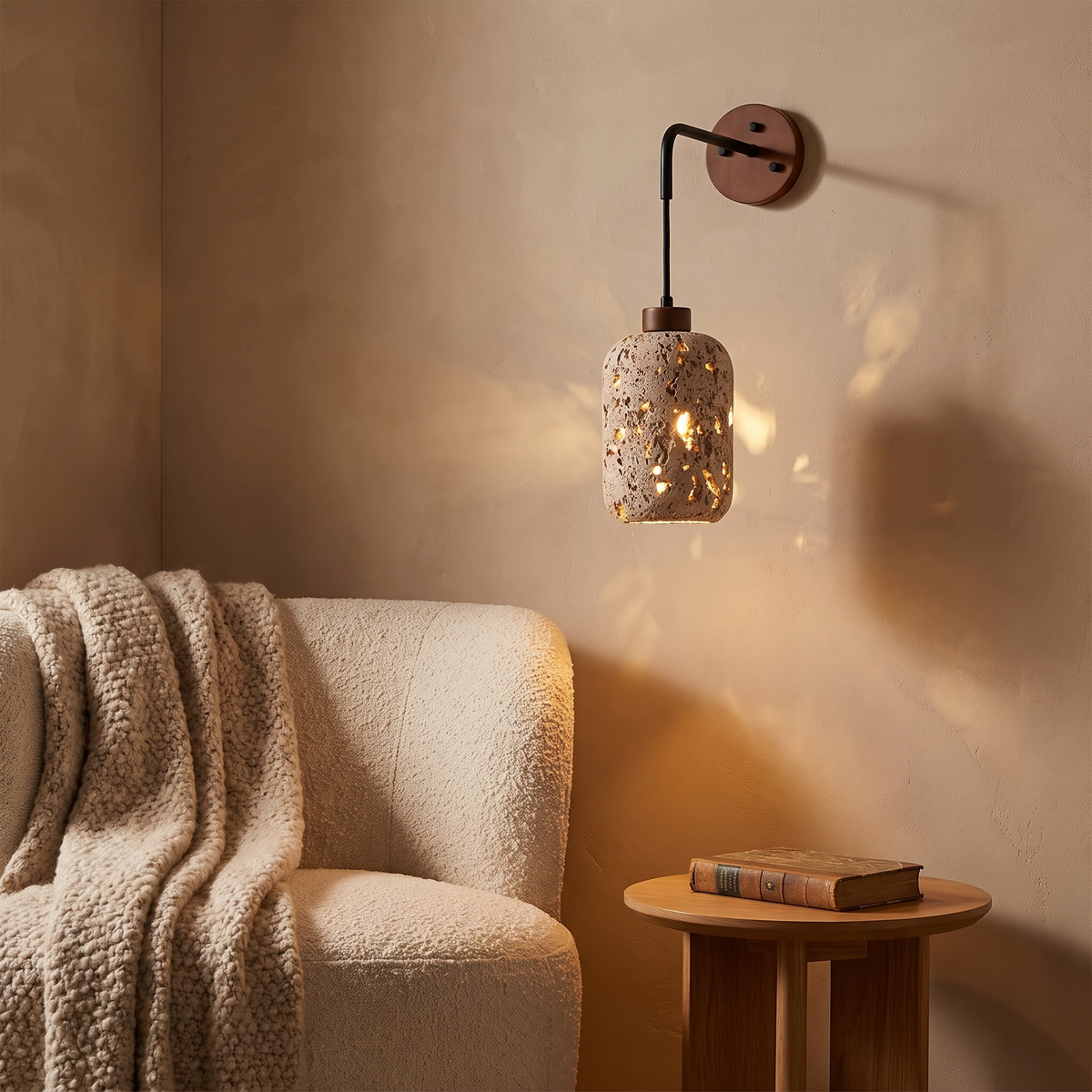 Nora travertine wall sconce in a reading nook