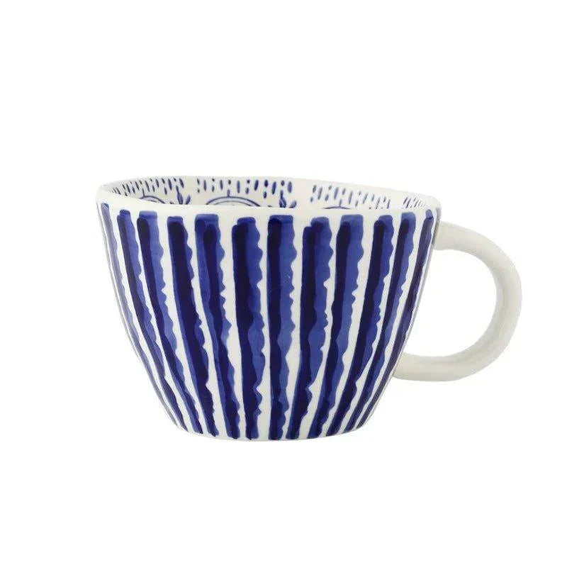 Noren Handcrafted Ceramic Coffee Cup in Blue on a kitchen counter