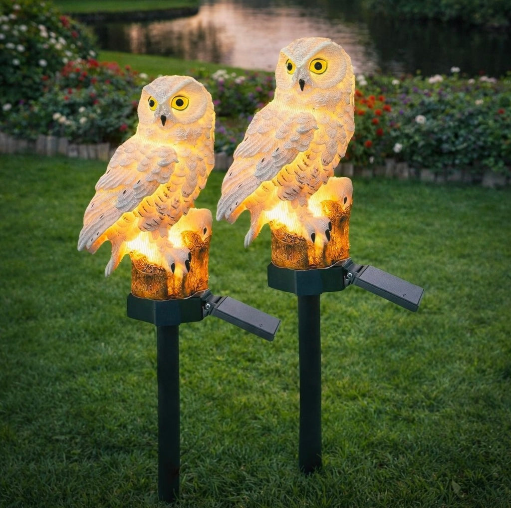 Owl Solar Garden Light illuminated at dusk on a lawn