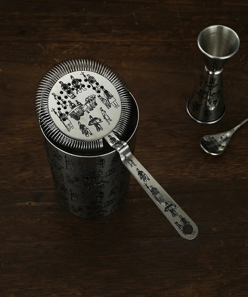 Sands cocktail set styled on a home bar with bar spoon and jigger