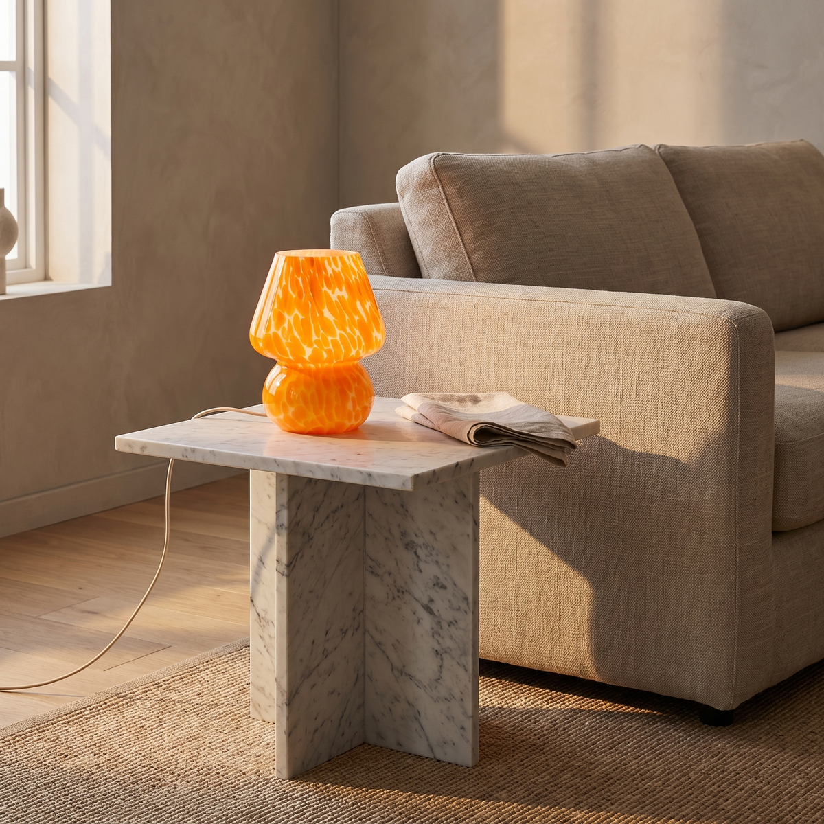 Sargi stained glass mushroom table lamp in orange on a marble side table in a warm living room
