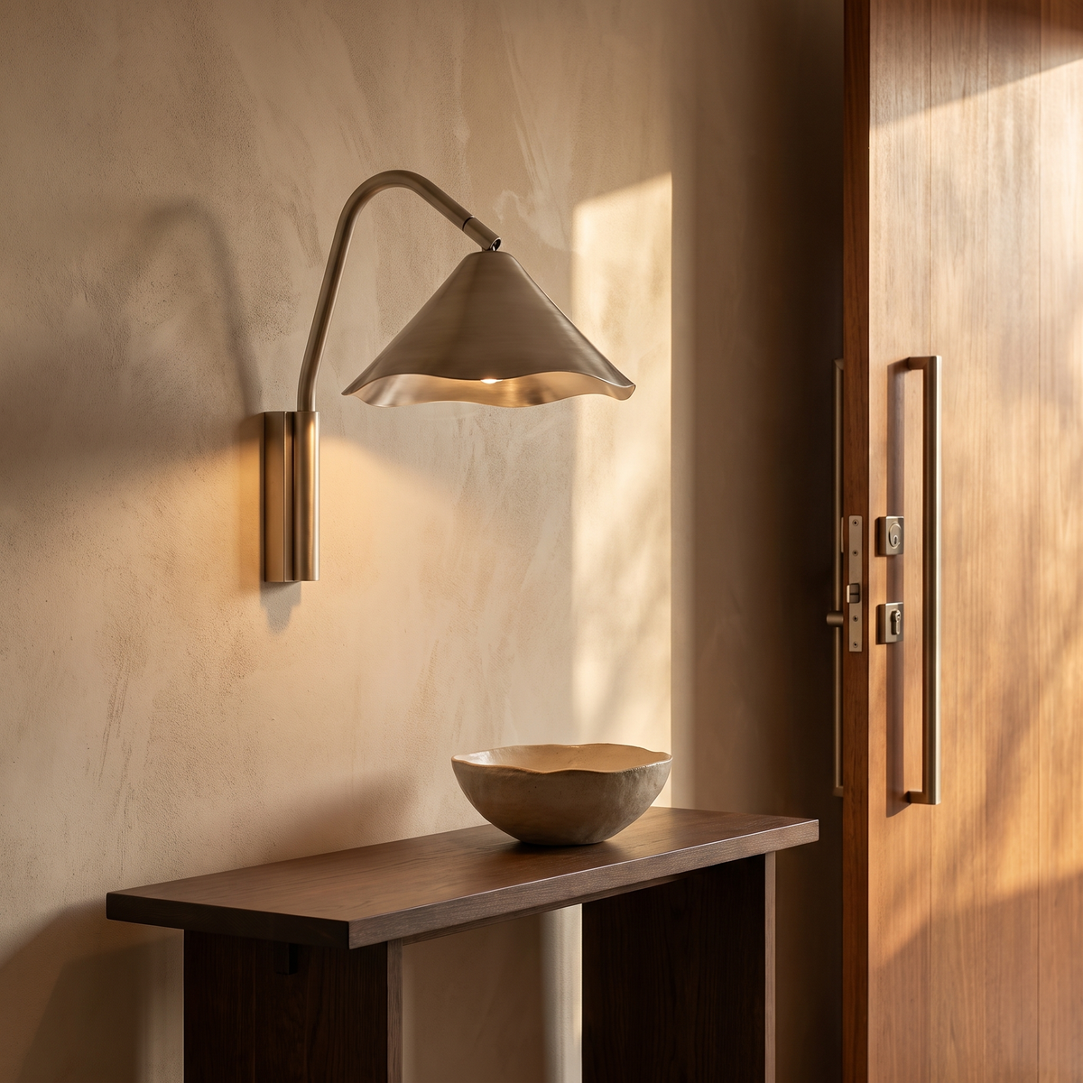 Sepo Arc wall sconce in an entryway near the front door