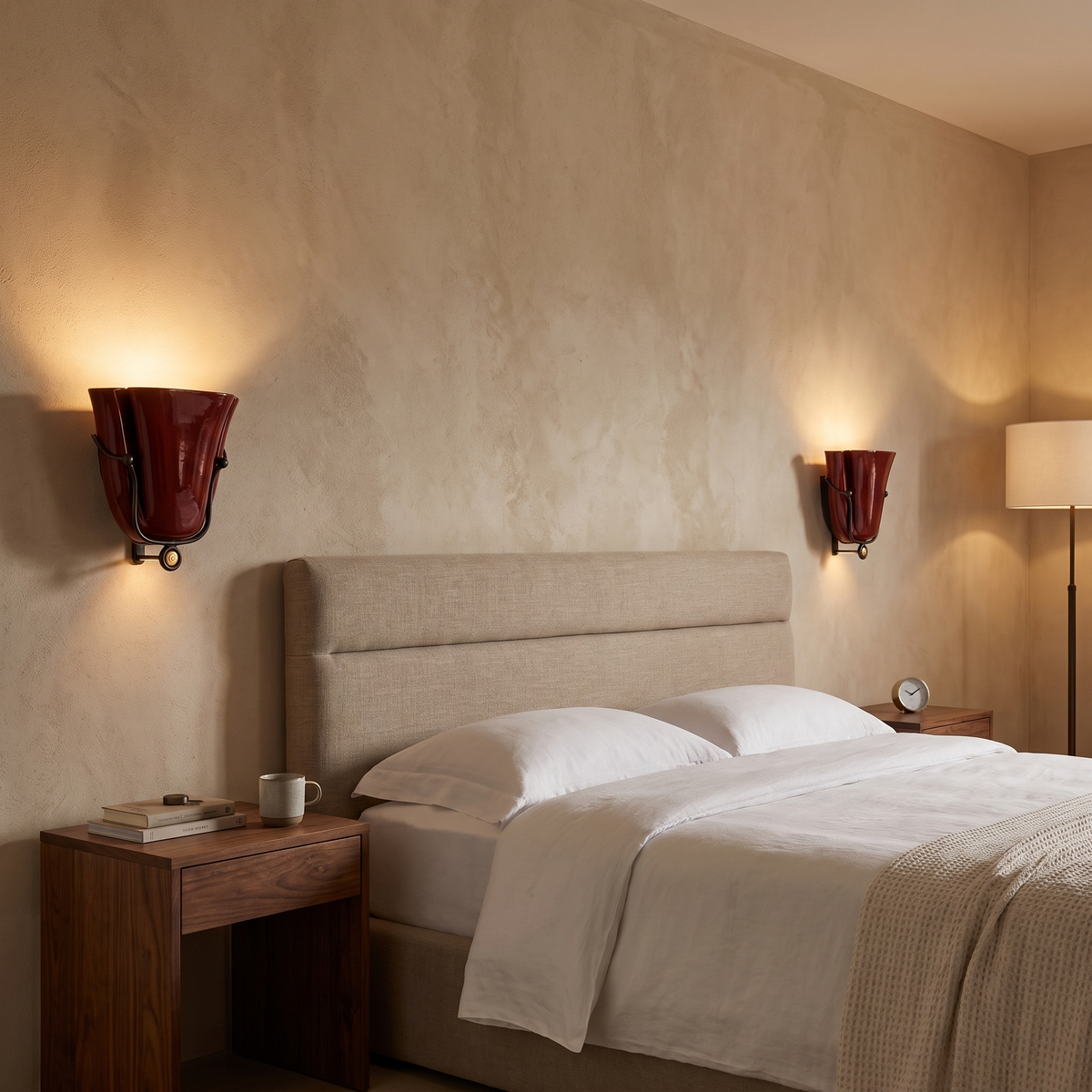 Smyth ceramic wall sconce in burgundy in a boutique hotel room