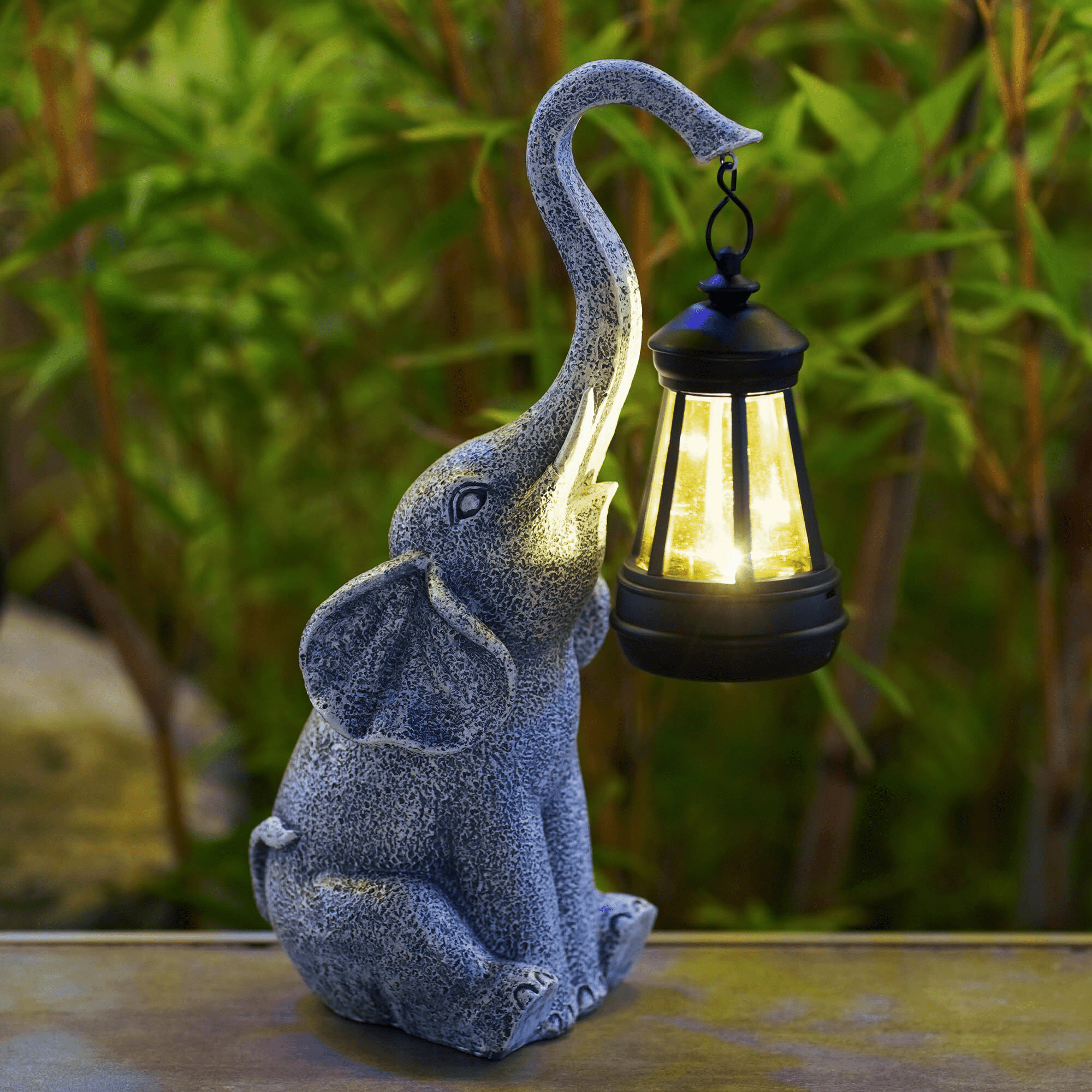 Solar Elephant Garden Light styled near a front entrance