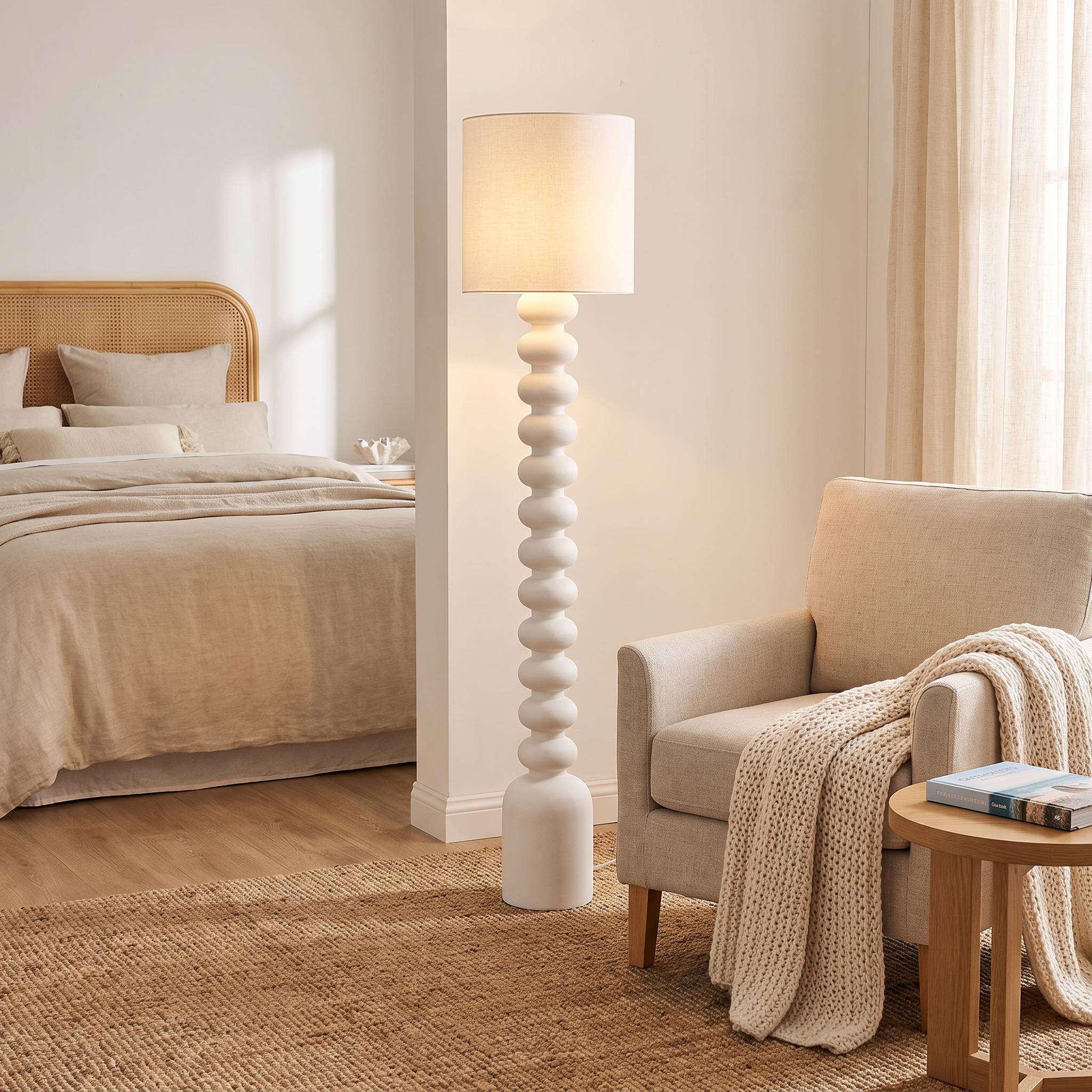 Sorrento floor lamp beside a reading armchair in a coastal bedroom corner