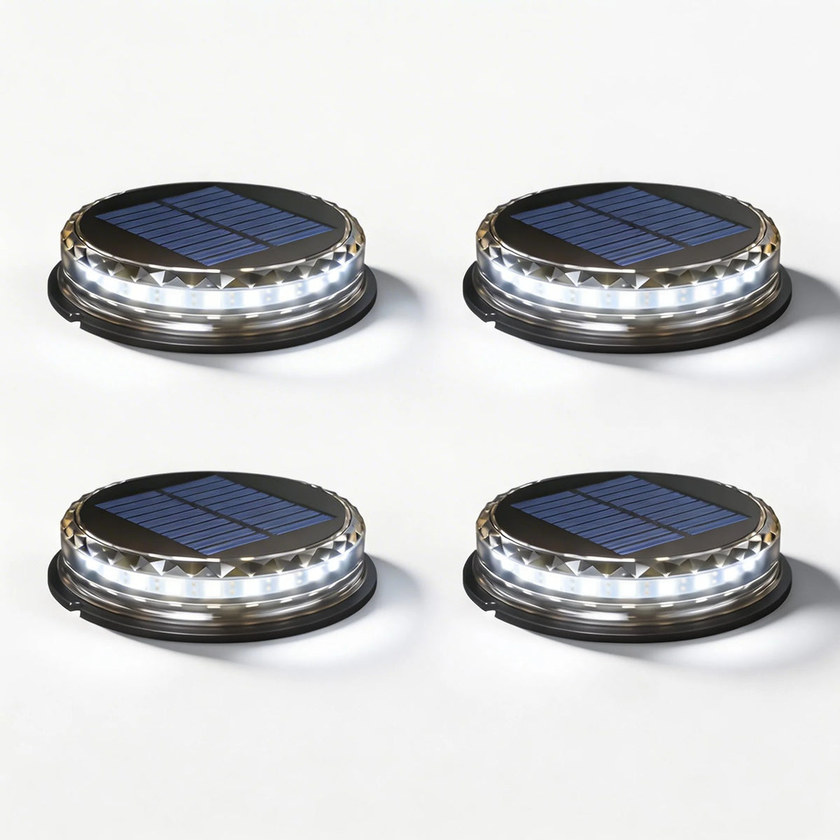 Set of four Stitch Outdoor Solar Garden Lights in black glowing cool white on a white background