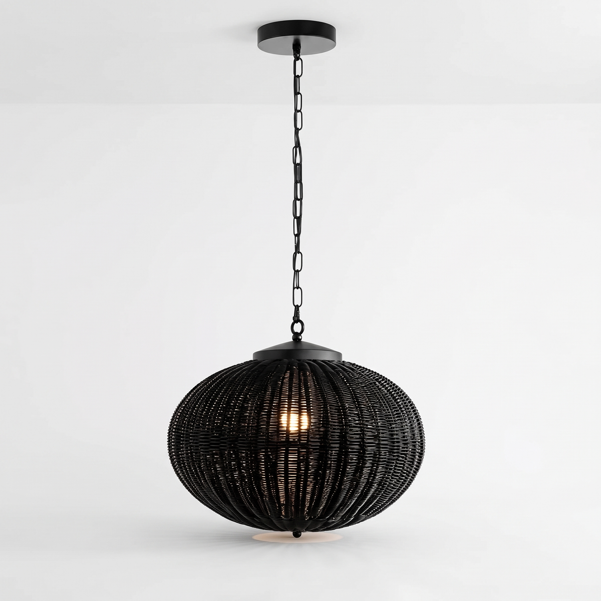 Suka black woven outdoor pendant light in the flat 40 x 25cm shape on a white background