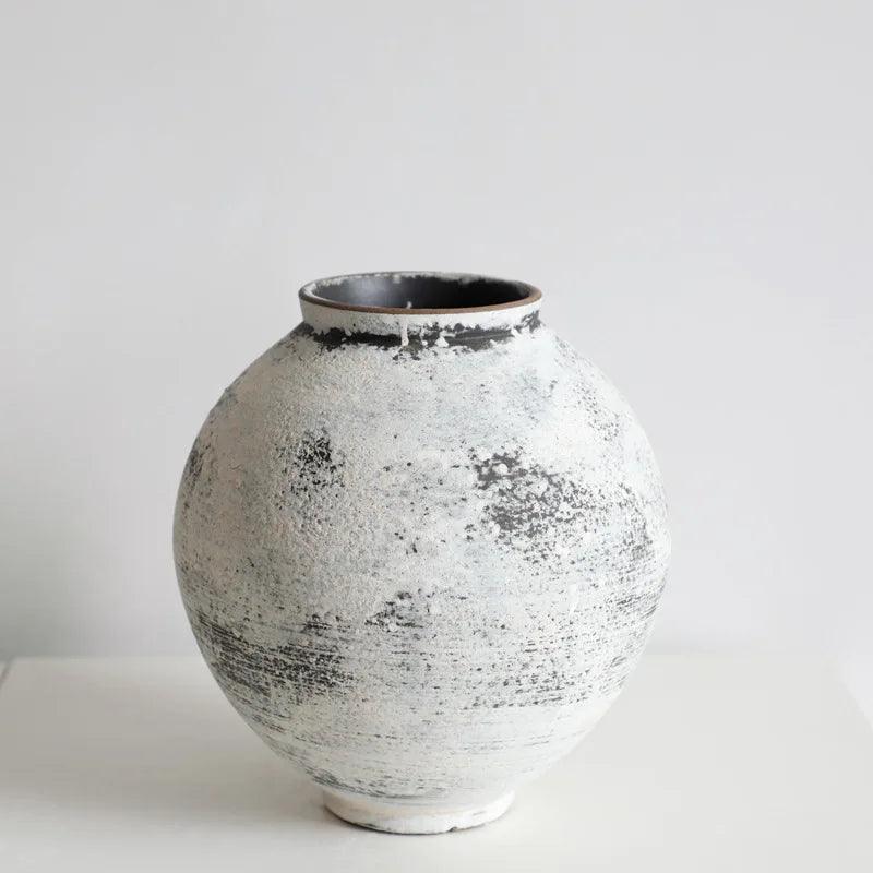 Close-up of the Tama Rustic Clay Vase showing its handcrafted textured surface