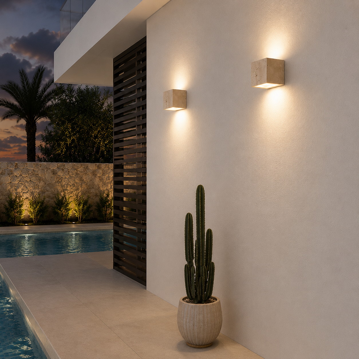 Teja outdoor wall light shown illuminated at night