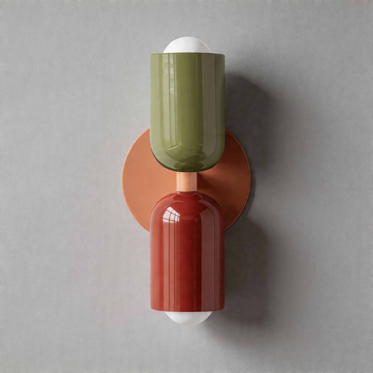 Vic Nordic up down wall sconce with a pink wall plate, green upper shade and red lower shade