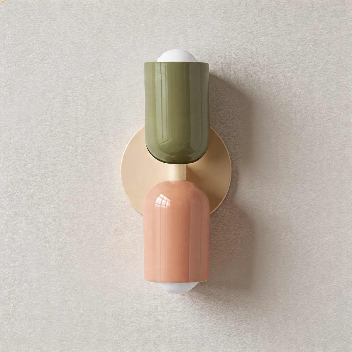 Vic Nordic up down wall sconce with a white wall plate, green upper shade and pink lower shade