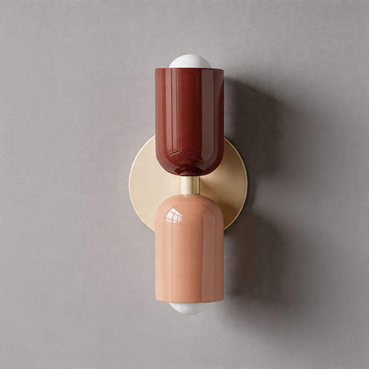 Vic Nordic up down wall sconce with a white wall plate, red upper shade and pink lower shade