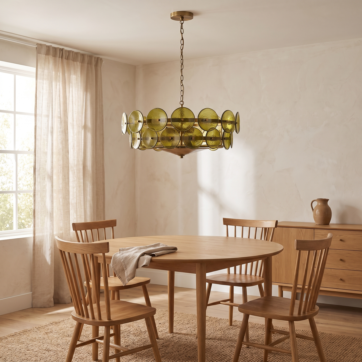 Yarra Retro Glass Chandelier in green above a round oak dining table in a Scandinavian dining room