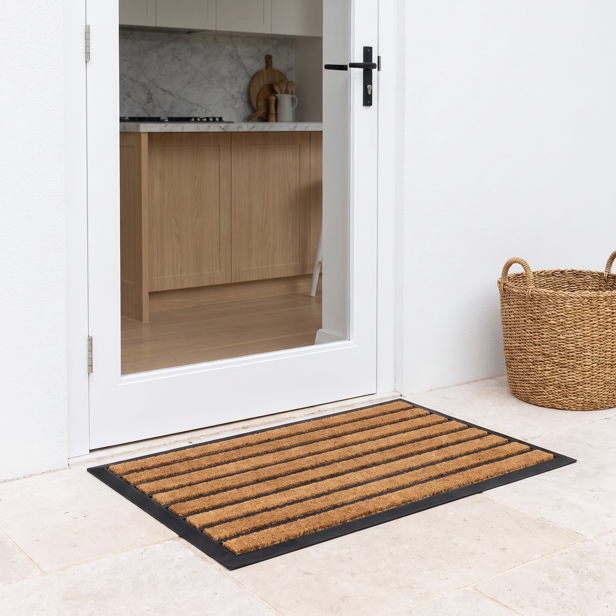 Zara striped doormat on limestone pavers at a courtyard back door