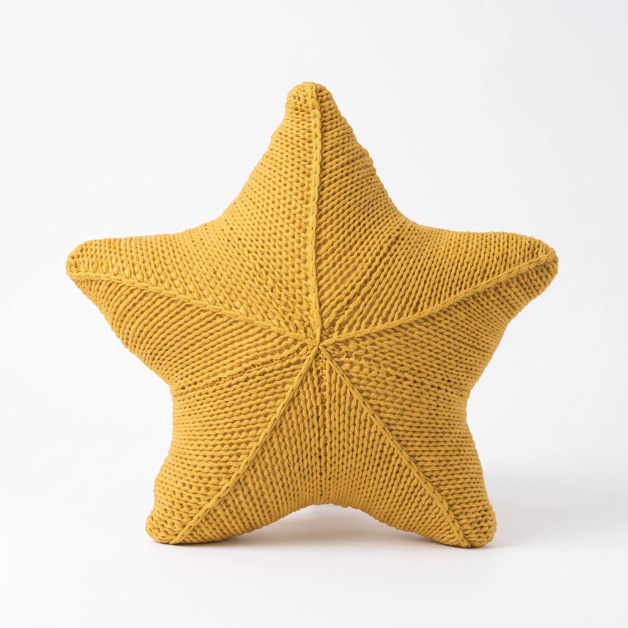 Zoe hand-knitted starfish cushion in Golden Shore on a white background