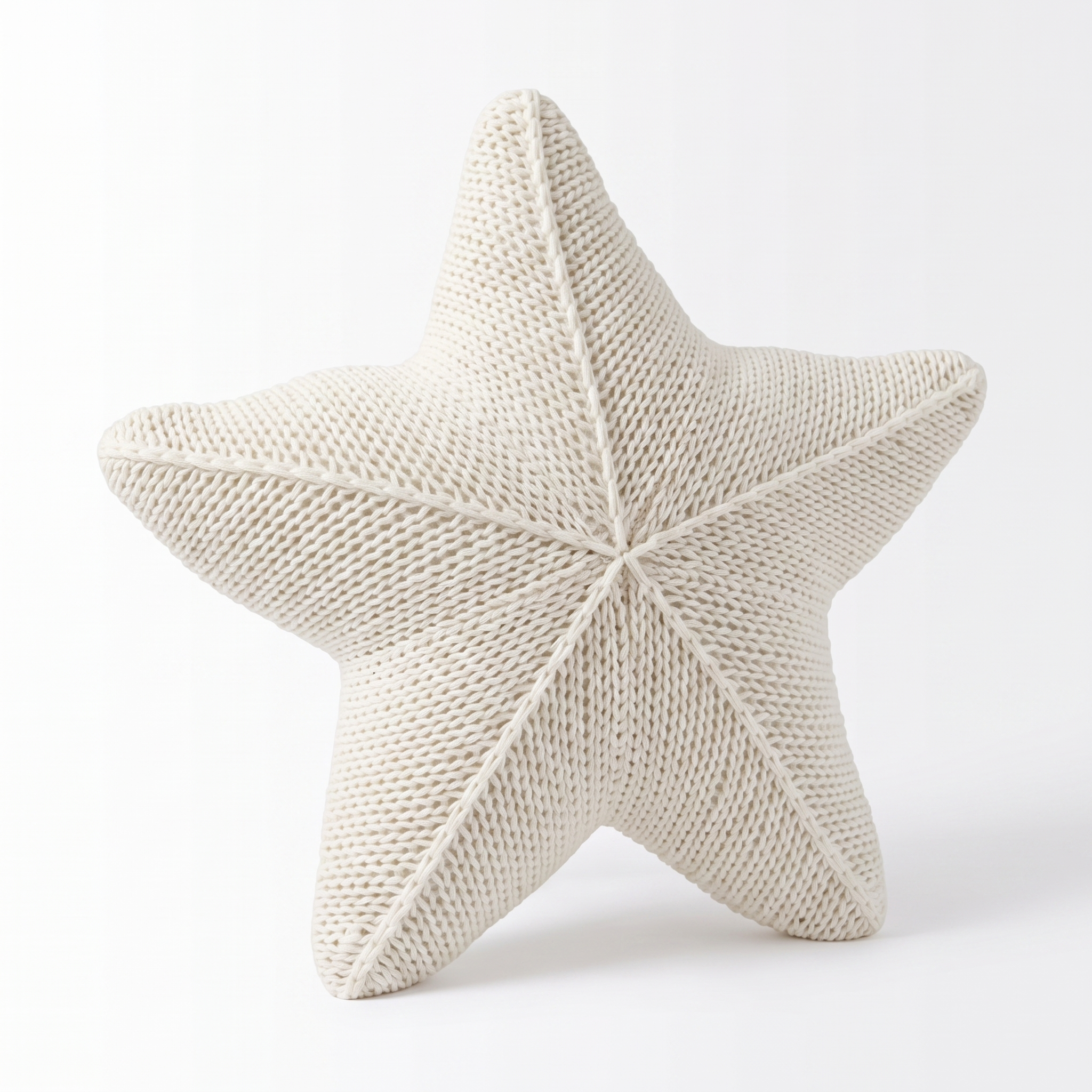 Zoe hand-knitted starfish cushion in Sea Foam on a white background